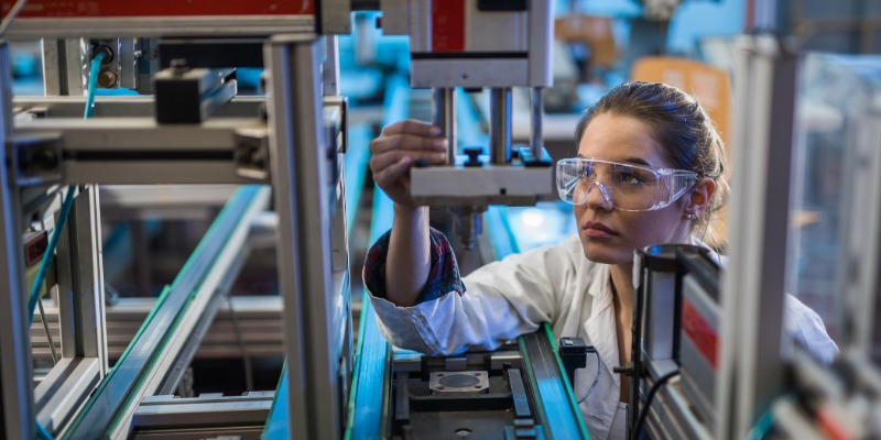 Girl wearing safety goggles working in a lab