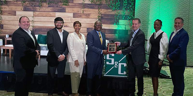 S&C President and CEO Anders Sjoelin presents Powered by Diversity Award to members of Rappahannock Electric Cooperative.